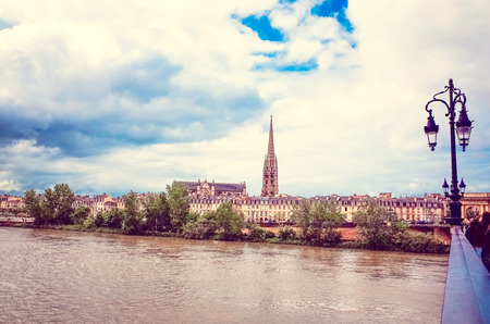 Bordeaux river bridge with St Michel cathedral の写真素材