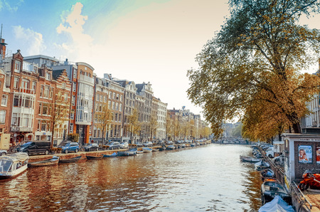 Amsterdam, Netherlands.-APRIL 23: Amsterdam canals on April 23, 2014. Beautiful view of Amsterdam canals with bridge and typical dutch houses.のeditorial素材