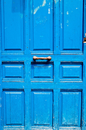 Old wooden door with metal handleの写真素材