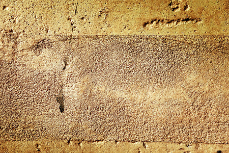 grungy wall - Sandstone surface backgroundの写真素材