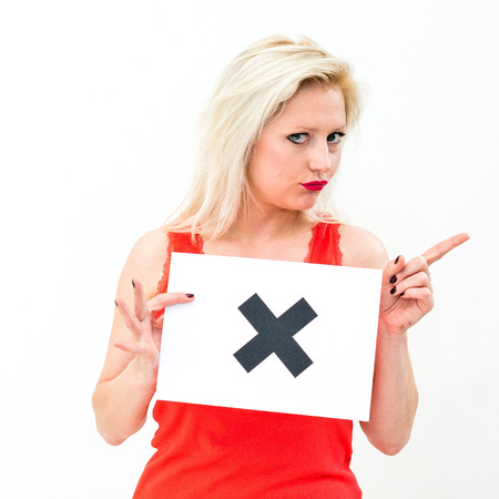 unhappy portrait young woman with board NOの写真素材
