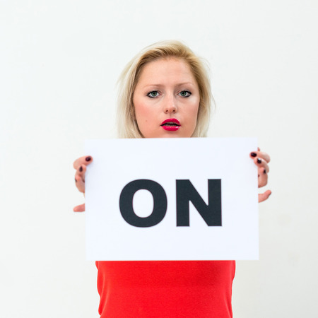happy portrait young woman with board ONの写真素材