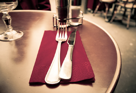 table setting - plate, knife and fork on tableの写真素材