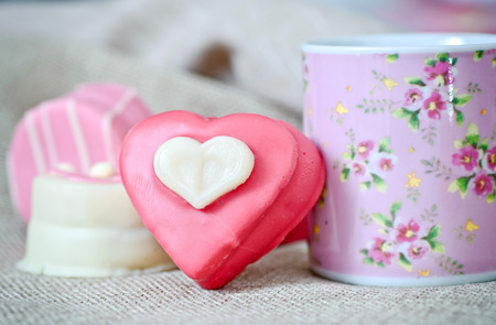 Small heart-shaped chocolates with white background, ideal for your valentine's design