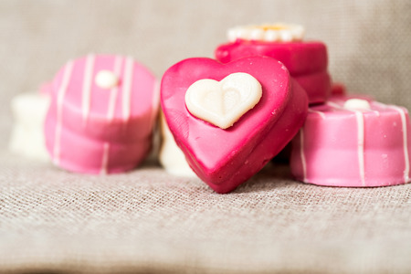 Small heart-shaped chocolates with white background, ideal for your valentine's designの写真素材