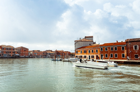 Beautiful view of water street and old buildings in Veniceの写真素材