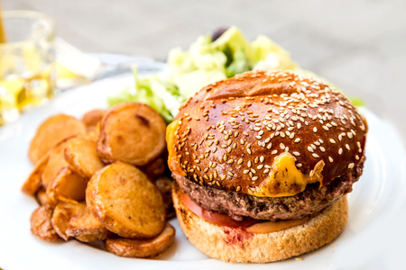 Cheese burger - American cheese burger with Golden French fries potatoes