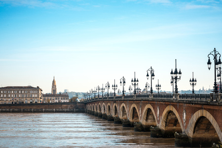 Bordeaux river bridge with St Michel cathedral, Franceの写真素材