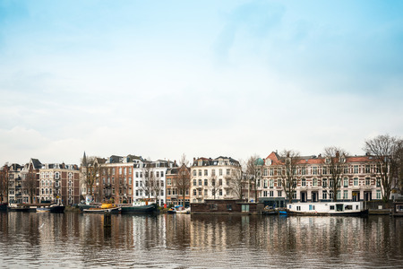 Amsterdam, Netherlands - March 31, 2016 : Beautiful view of Amsterdam canals with bridge and typical dutch houses. Amsterdam, Netherlandsのeditorial素材