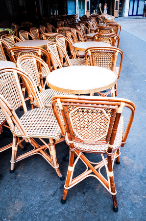 Street view of a coffee terrace with tables and chairs in europeの写真素材