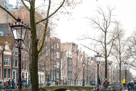 Amsterdam, Netherlands - March 31, 2016 : Beautiful view of Amsterdam canals with bridge and typical dutch houses. Amsterdam, Netherlandsのeditorial素材