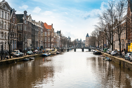 Amsterdam, Netherlands - March 31, 2016 : Beautiful view of Amsterdam canals with bridge and typical dutch houses. Amsterdam, Netherlandsのeditorial素材