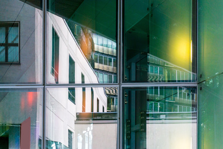 View of a modern glass skyscraper buildings aroundの写真素材