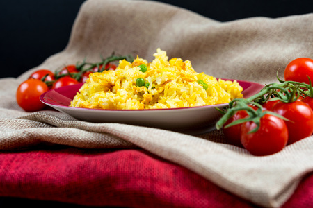 Homemade Chinese fried rice with vegetables and fried eggs