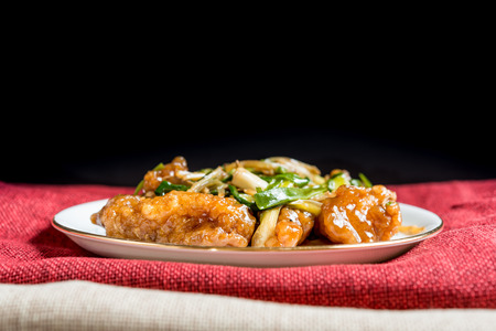 wok fried chicken stir fry with sweet peppers and chinese vegetablesの写真素材