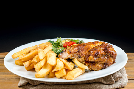 delicious chicken on white plateの写真素材