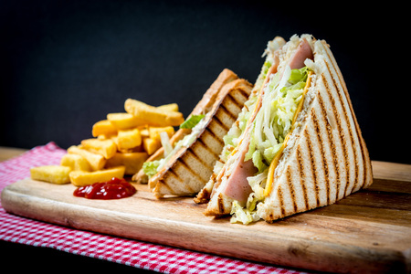 Sandwich with bacon - chicken, cheese and lettuceの写真素材