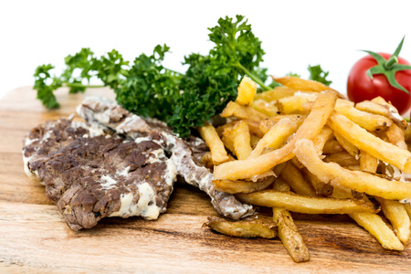 juicy steak beef meat with tomato and french friesの写真素材