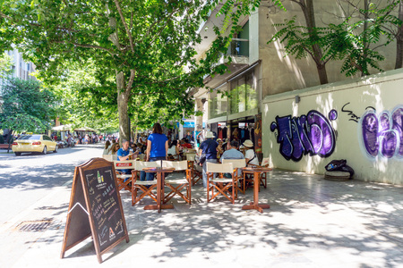 ATHENS, GREECE - May 3, 2017: Tourists on foot Graben Street in Athens.のeditorial素材