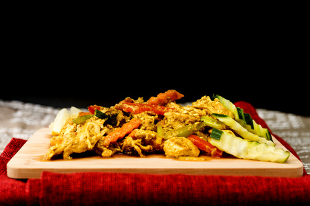 wok fried chicken stir fry with sweet peppers and chinese vegetablesの写真素材