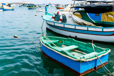 Traditional boats at Marsaxlokk Harbor in Maltaの写真素材