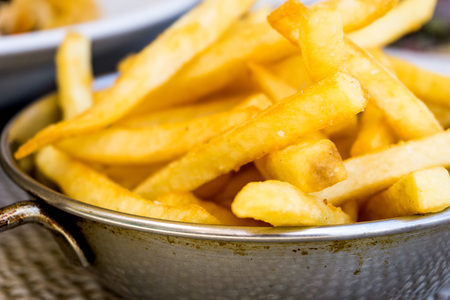 Golden French fries potatoes ready to be eaten