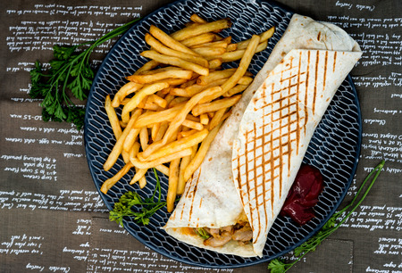 Mexican fajita wraps with grilled chicken fillet and fresh vegetables