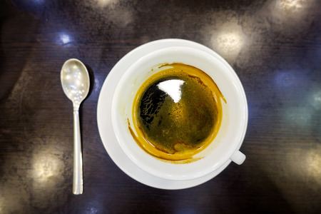 wonderful white cup of hot coffee on tableの写真素材