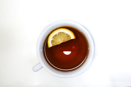 wonderful white cup of hot tea on tableの写真素材