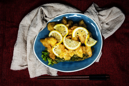 Chinese food fried fish and lemon slicesの写真素材