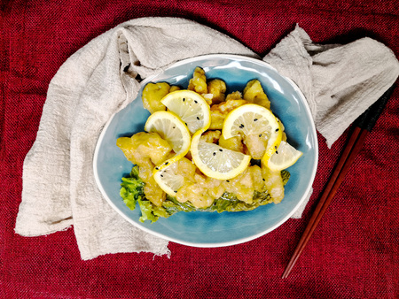 Chinese food fried fish and lemon slicesの写真素材