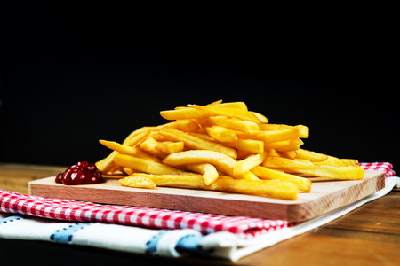 Golden French fries potatoes ready to be eatenの写真素材
