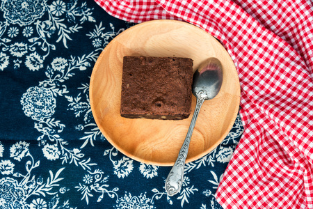 Chocolate Brownie cake on a dark plateの写真素材