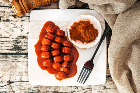 Tasty german sausage served with sauceの写真素材