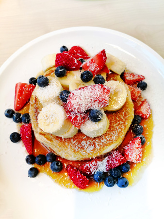 delicious Strawberry pancake stack with honey