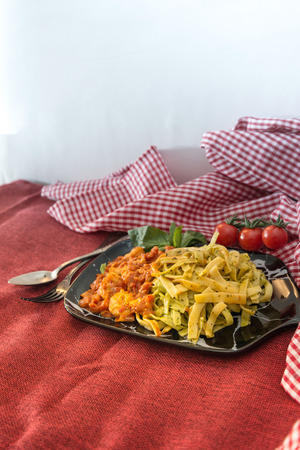 spaghetti with pesto sauce and Shrimp on a the tableの写真素材
