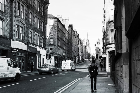 EDINBURGH, SCOTLAND - March 27, 2017: People are walking through a narrow street in Old Town Edinburgh, Scotland  のeditorial素材