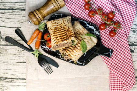 Mexican fajita wraps with grilled chicken fillet and fresh vegetablesの写真素材