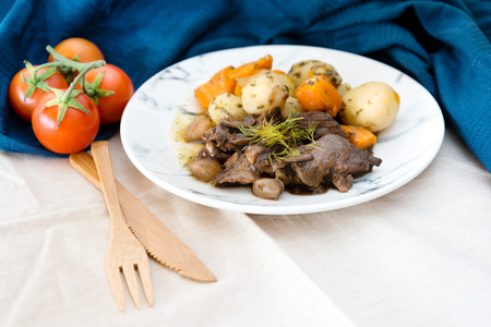 Beef meat stewed with potatoes-Traditional French cuisine Beef Bourguignon potatoes carrots in persilladeの写真素材