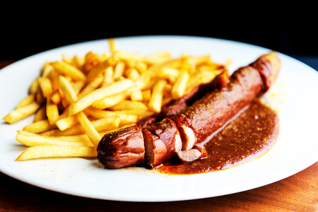 Tasty german sausage served with sauceの写真素材