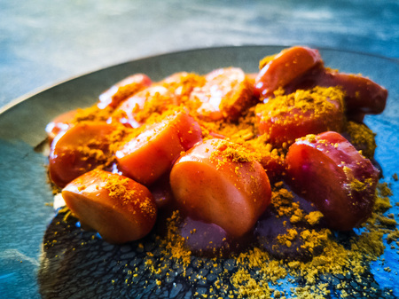 Tasty german sausage served with sauceの写真素材