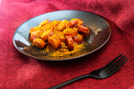 Tasty german sausage served with sauceの写真素材