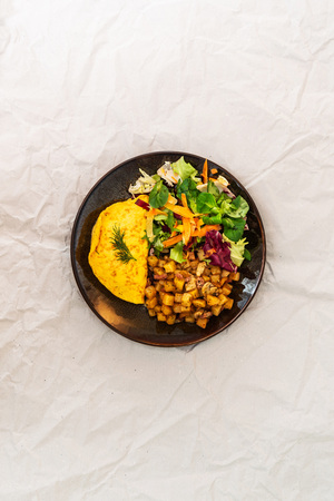 French Omelette with Potatoes, Mushroom and Saladの写真素材