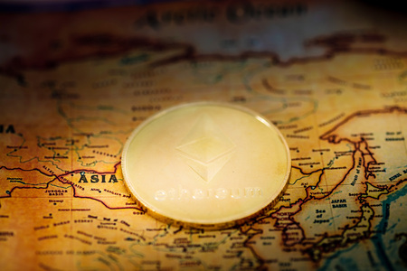 Digital currency concept - Crypto currency Ethereum on map of Asia