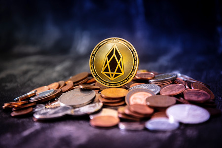 Golden EOS.IO and mound of money. Digital cryptocurrency conceptの写真素材