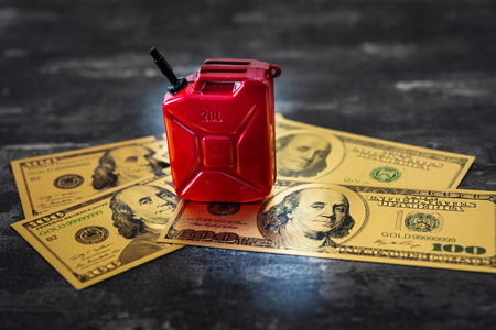Barrel of gasoline and US Dollar Oil crisis conceptの写真素材