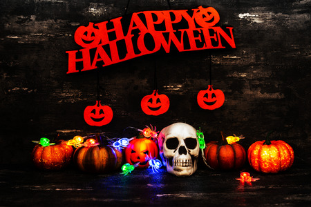 Halloween concept with a pumpkin and skeleton on backgroundの写真素材