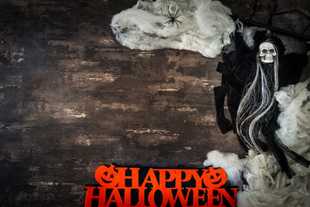 Halloween concept with a pumpkin and skeleton on backgroundの写真素材