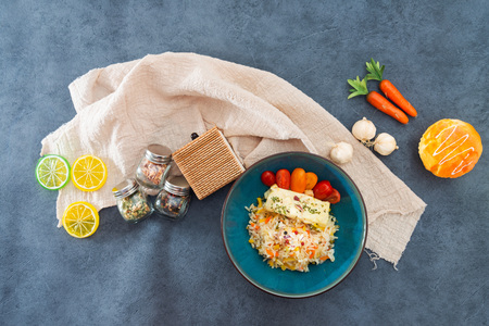 Baked salmon, vegetables and sorrel sauce accompanied oatmeal, lentil and cooked rice