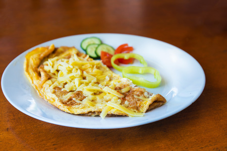 omelet with ham tomato and green saladの写真素材